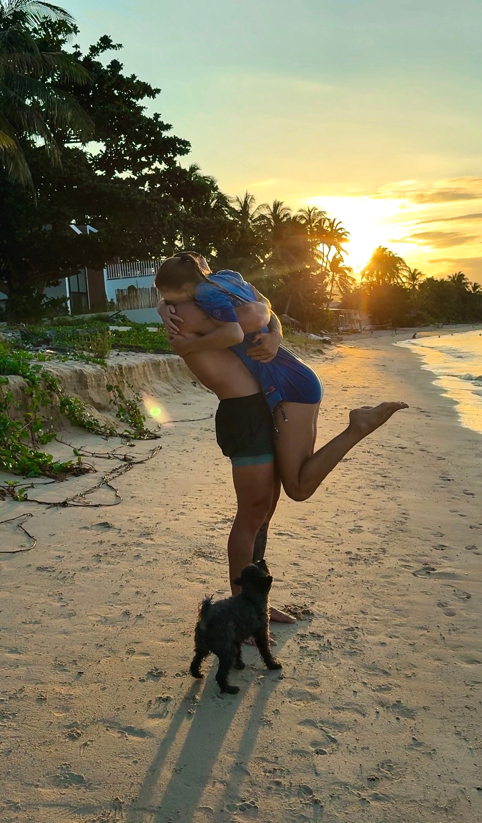 Timon and his wife on the beach at sunset